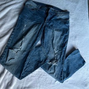 Splattered ripped jeans